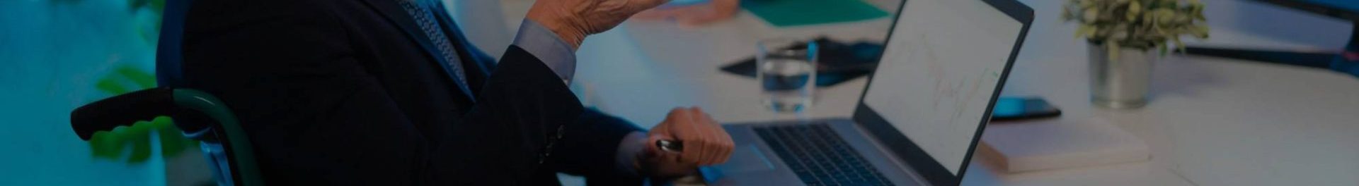 Alt text: Scholar uploading a thesis on a laptop for publication in Great Britain Journals Press.